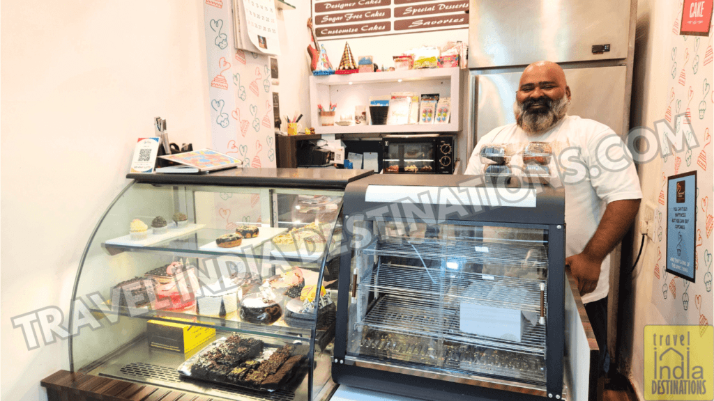 A picture of storeowner at Brownie Point Store in Vasai, one of the best cake shops in Mumbai.