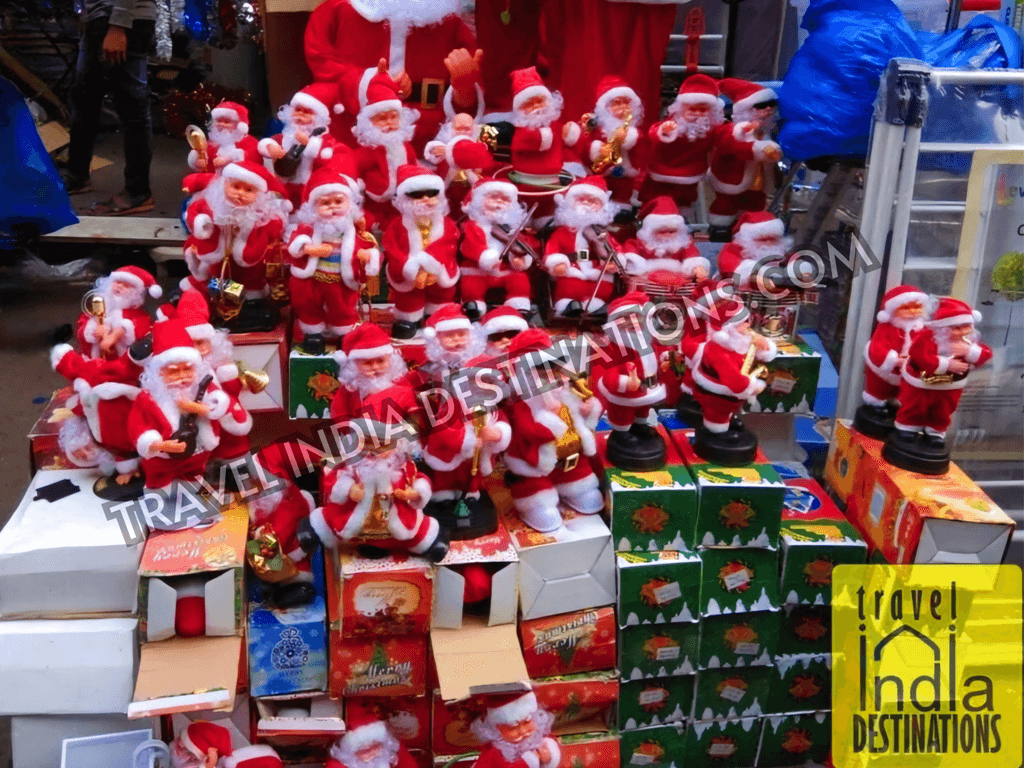 A roadside seller selling Santa figurine Christmas toys near Borivali I.C. Colony.