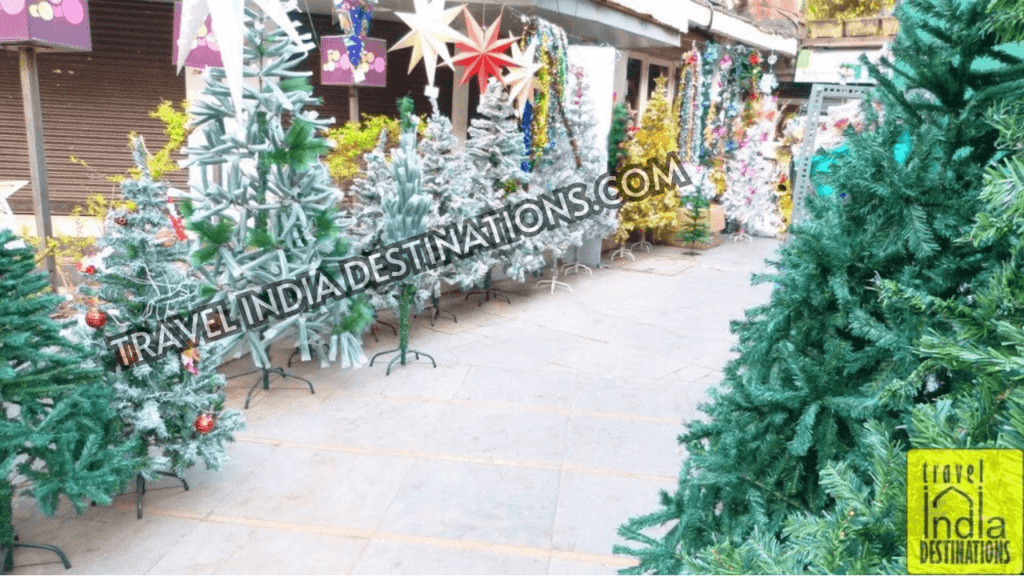 A range of Christmas trees on the pavement outside a store in Hill Road Bandra one of the best Christmas markets in Mumbai.