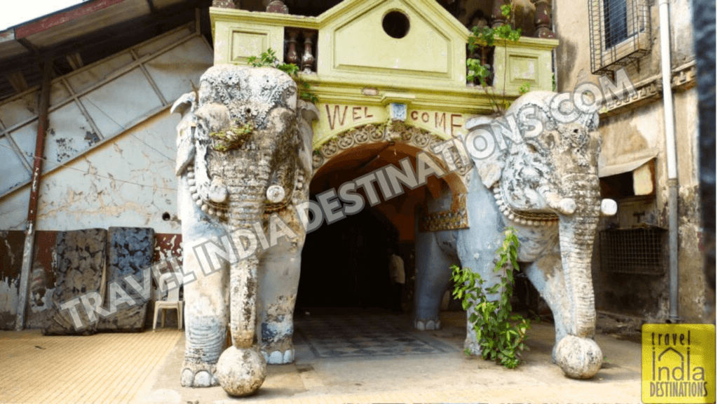 The rear gate of Imperial Cinema on Lamington Road Mumbai with elephant designed pillars to welcome movie goers.