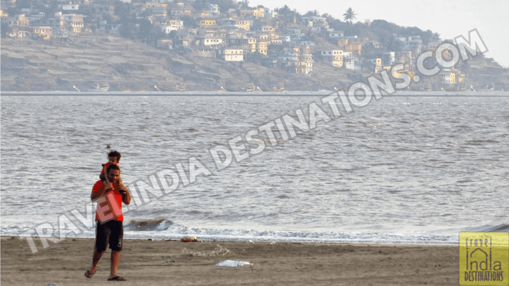A shot of a parent with a kid at Suruchi Beach.