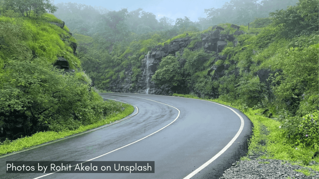 A curvy road of Tamhini Ghat one of the popular ghats in Maharashtra ideal for monsoon road trip from Mumbai.