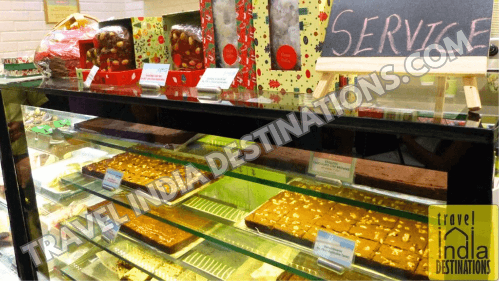 A shot of Christmas hampers on display at Theobroma Colaba store, one of the best shops for Christmas cakes in Mumbai.