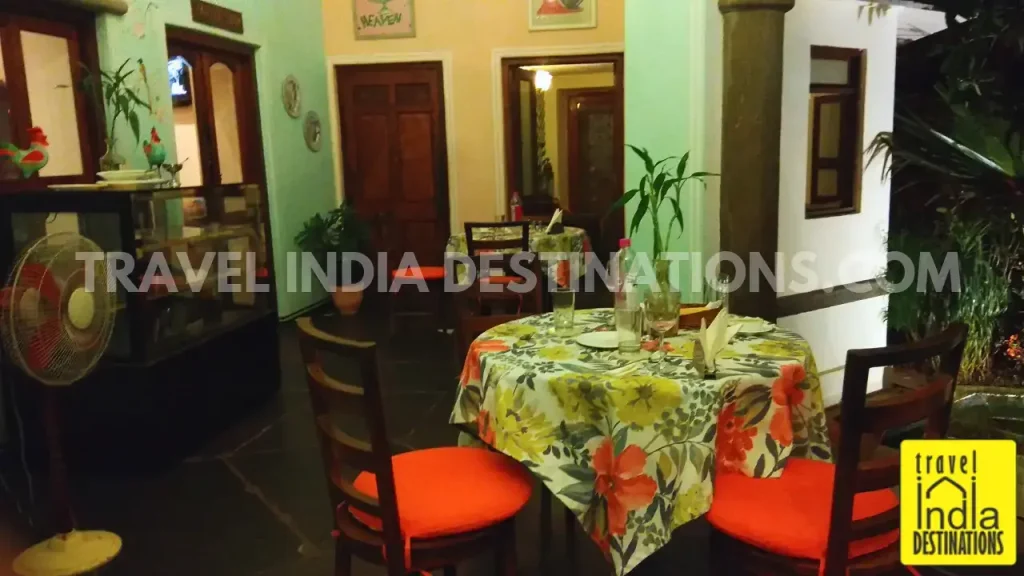 A shot of lounge area with colourful chairs and table at 1559 AD Udaipur restaurant.