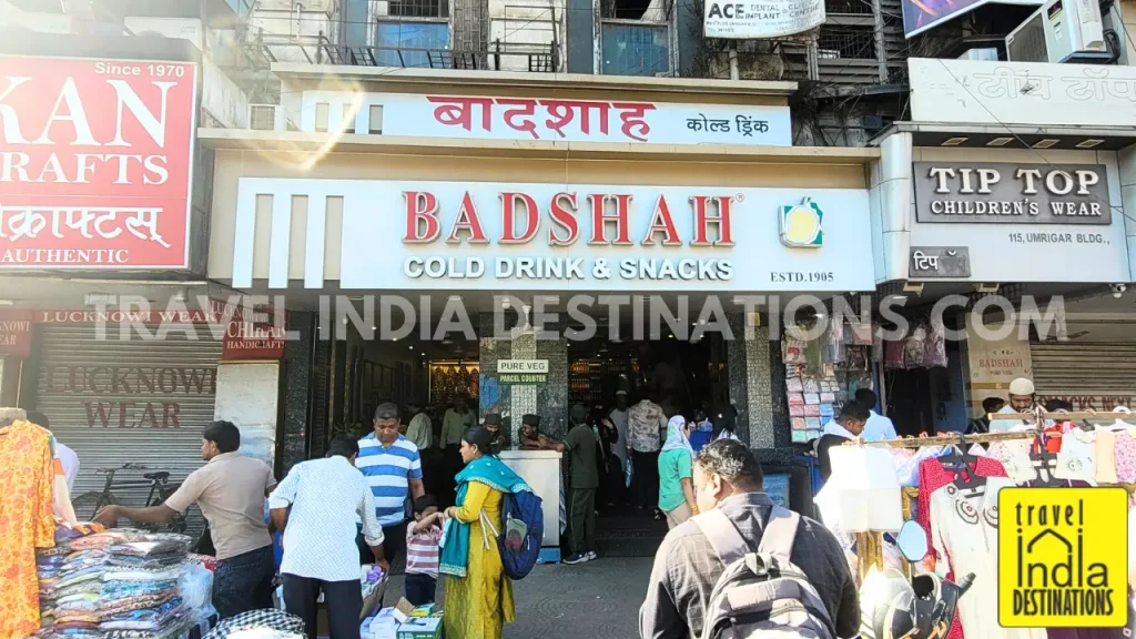 Exterior shot of Badshah Cold Drink & Snacks at Crawford Market, offering one of the best faloodas in Mumbai.