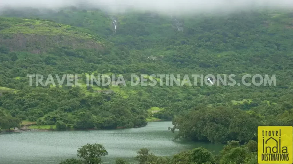 The reservoir of Bhushi Dam Lonavala, with calm waters surrounded by lush greenery, one of the best places for monsoon road trips in Maharashtra.