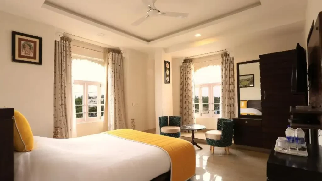 Well-lit and neatly furnished room at Bloom Boutique Udaipur near the City Palace area.