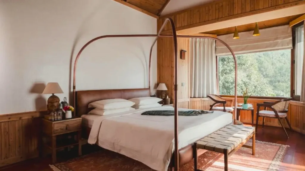 Cozy interiors at Brij Atmanya luxury hotel in Bhowali near Nainital, one of the best hotels for minimoon in April.
