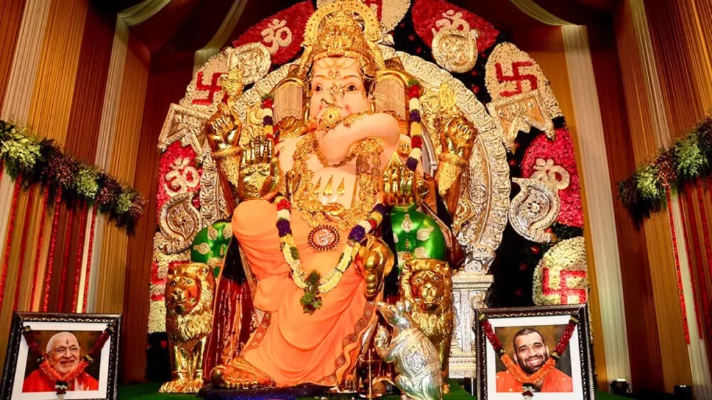 Gold-clad GSB Seva Ganpati idol featuring traditional jewellery and serene facial expression one of the richest Ganpati pandals in Mumbai