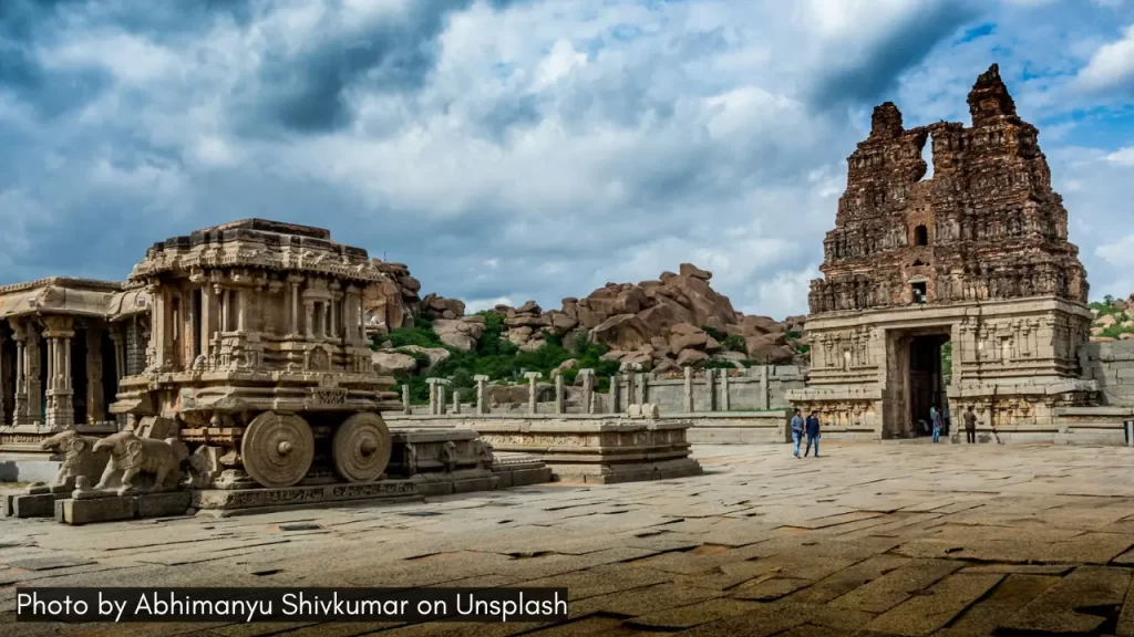 Boulders and temples of Hampi, one of the best places to visit in monsoon in Karnataka.