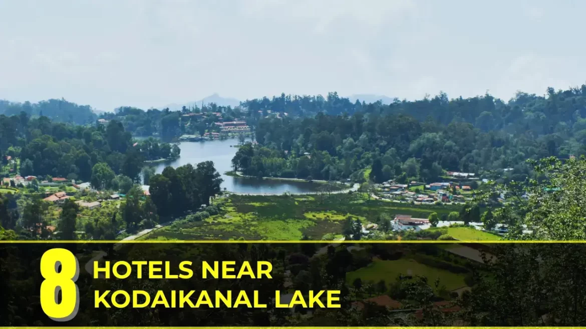 Scenic aerial view of Kodaikanal Lake surrounded by lush greenery and hilltop hotels in Tamil Nadu, India.