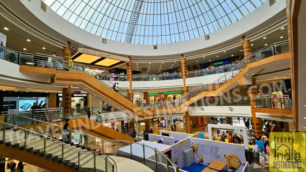 Interior view of InOrbit Mall Malad showcasing the central dome and multiple retail store fronts
