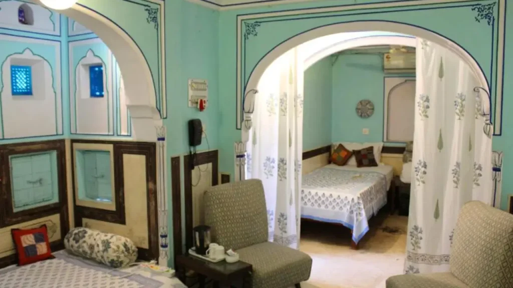 Cozy interiors of the Triple Room with Bathroom at Jaipur Haveli one of the budget heritage hotels close to Johari Bazar.