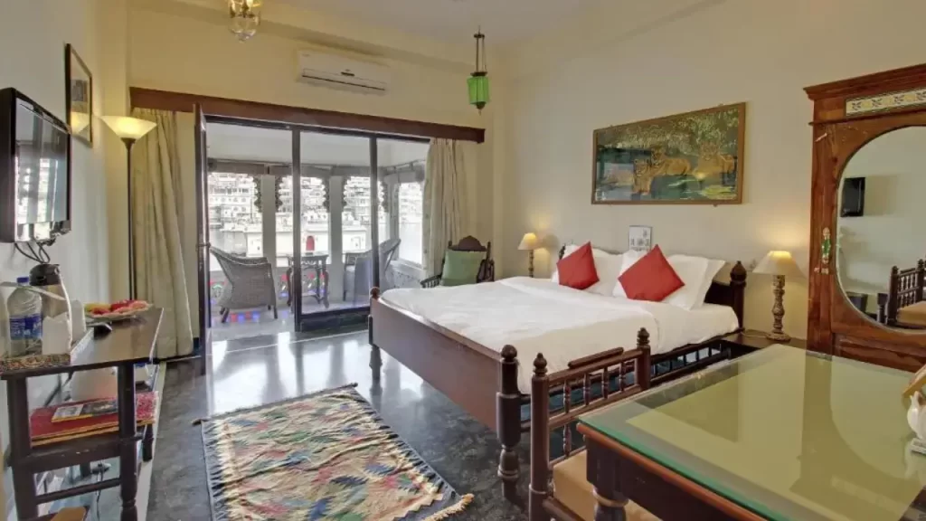 Heritage-style suite with lake views at Lake Pichola Hotel near City Palace Udaipur.