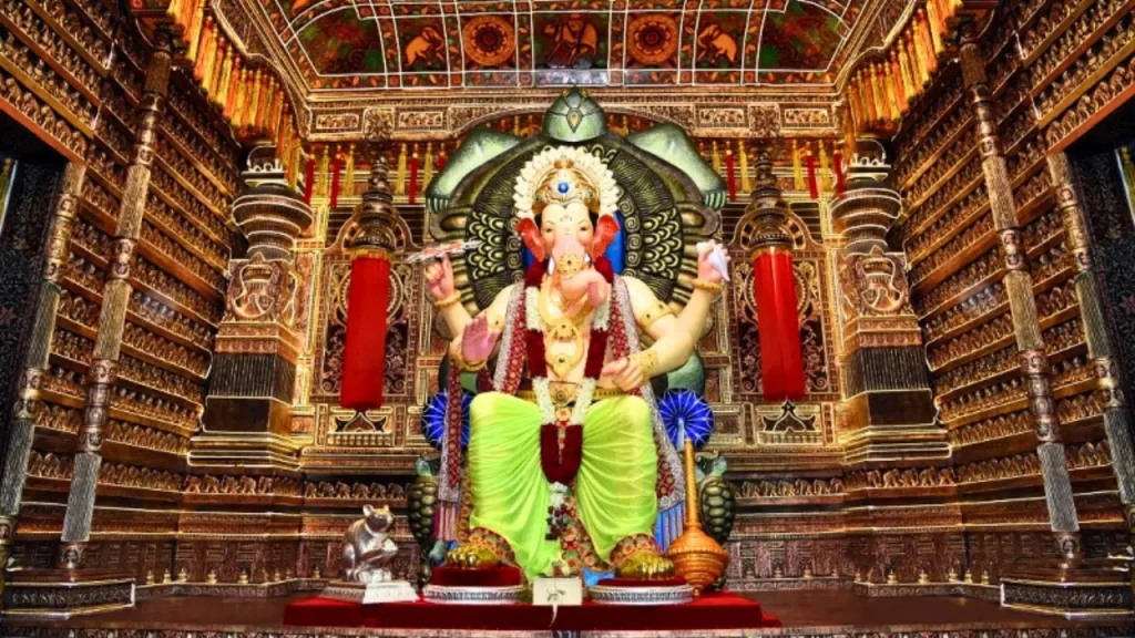 Close view of the majestic Lalbaugcha Raja idol adorned with traditional gold ornaments, one of the top Ganpati pandals in Mumbai