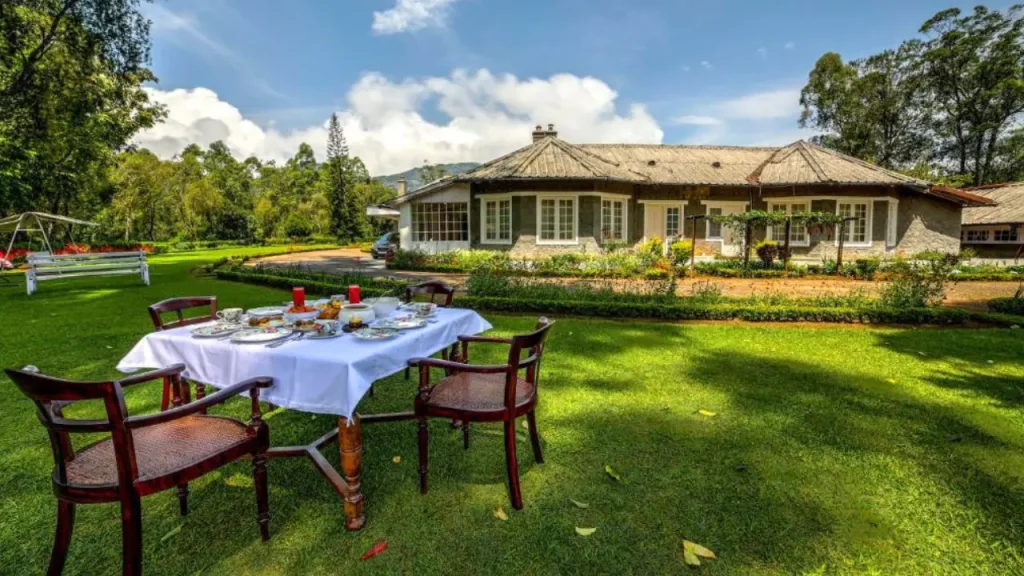 Exteriors of the Lockhart luxury bungalow with spacious garden and outdoor dining for minimoon in June in India.
