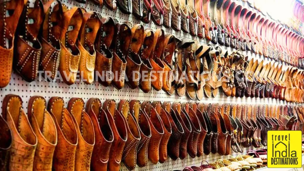 Leather footwear known as mojris on display in a store in Jaipur market.