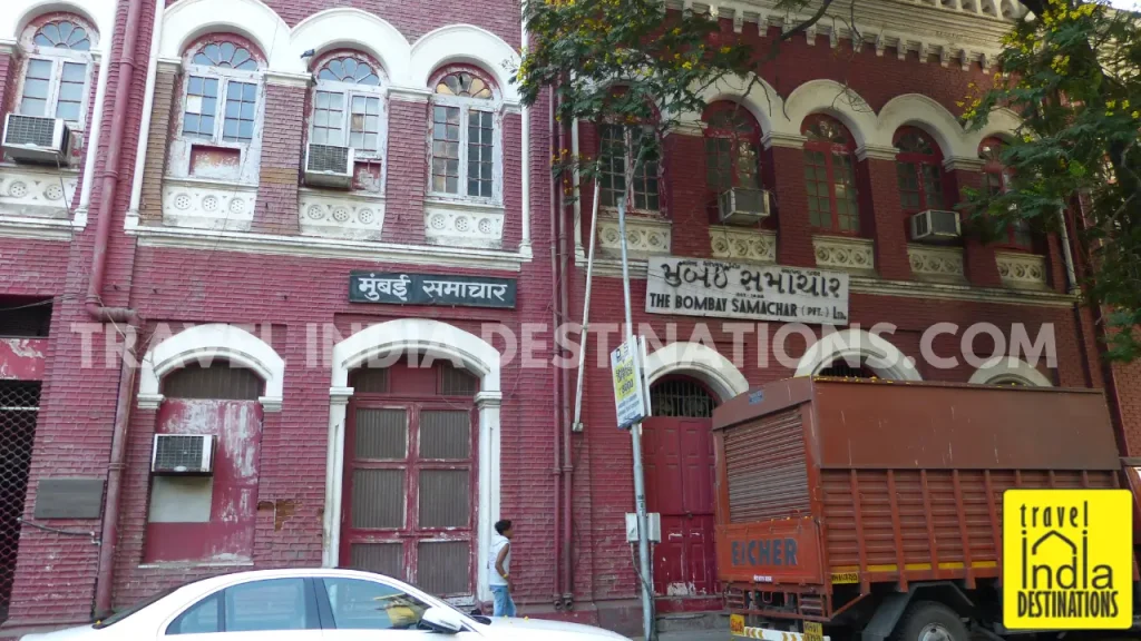 Exterior of the red-brick Mumbai Samachar building, one of the oldest heritage structures in Kala Ghoda Mumbai.