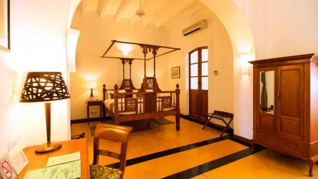 A luxurious heritage-style room at Palais de Mahe, one of the luxurious beach hotels in Pondicherry.