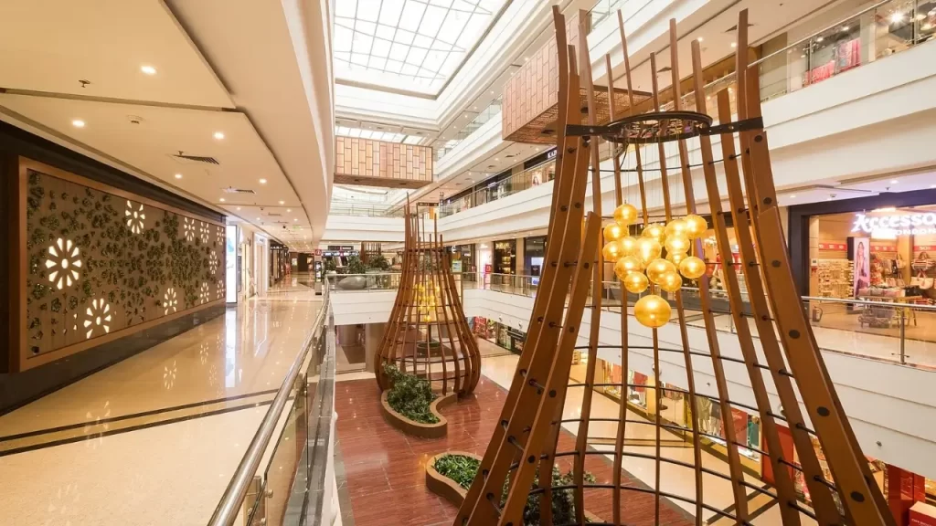 Interior view of Phoenix Marketcity Kurla, one of the largest malls in Mumbai, with multiple floors, branded stores, and vibrant festive décor
