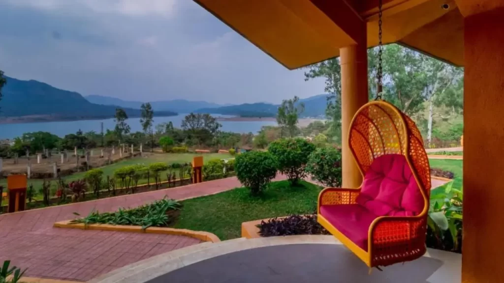 Residency Lake Resort Mulshi with swing chair overlooking lake and hills