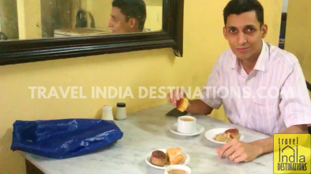 Sharukh Bamboat enjoying mawa cakes and Irani chai at B. Merwan & Co cafe