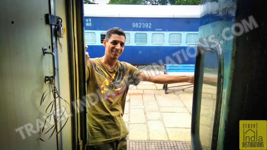 sharukh posing at the door of the train heading to Udaipur