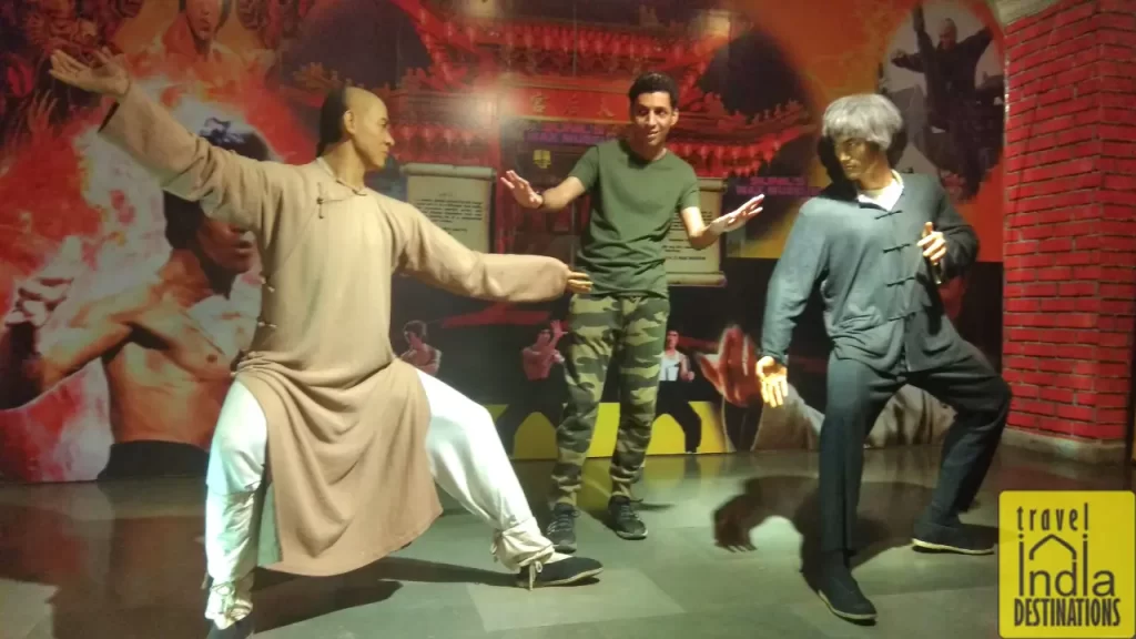 A person at Sunil's Wax Museum in Lonavala posing for camera.