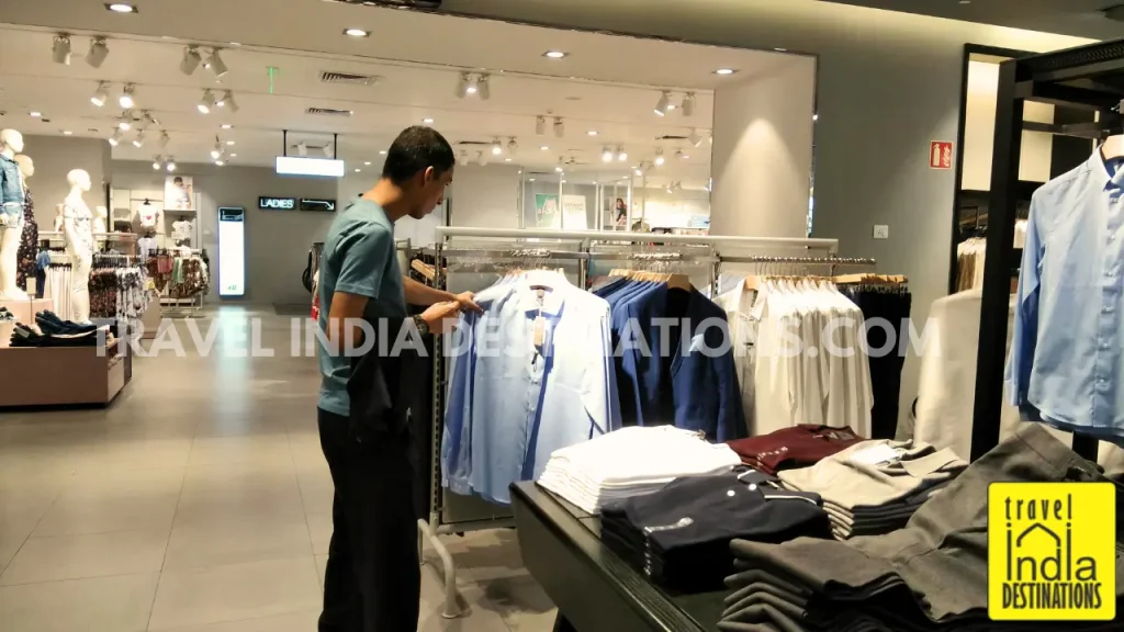 A man checking out formal wear in a shopping mall in Jaipur.