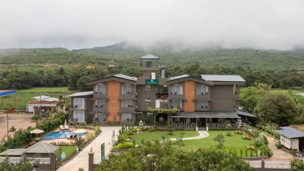 Stone Wood Hotel Amboli with misty green mountain backdrop