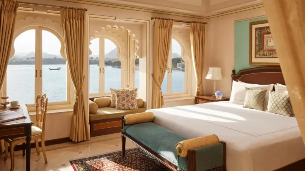 Luxurious palace-style room at Taj Fateh Prakash overlooking Lake Pichola near City Palace.