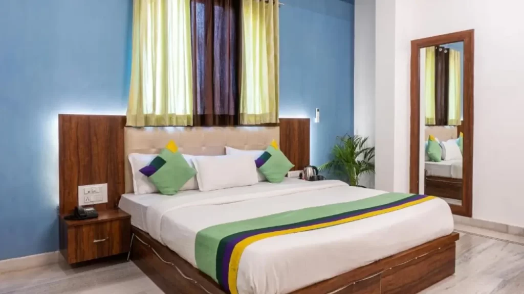Standard room at Treebo The Fresco near City Palace Udaipur with modern interiors and soft lighting.