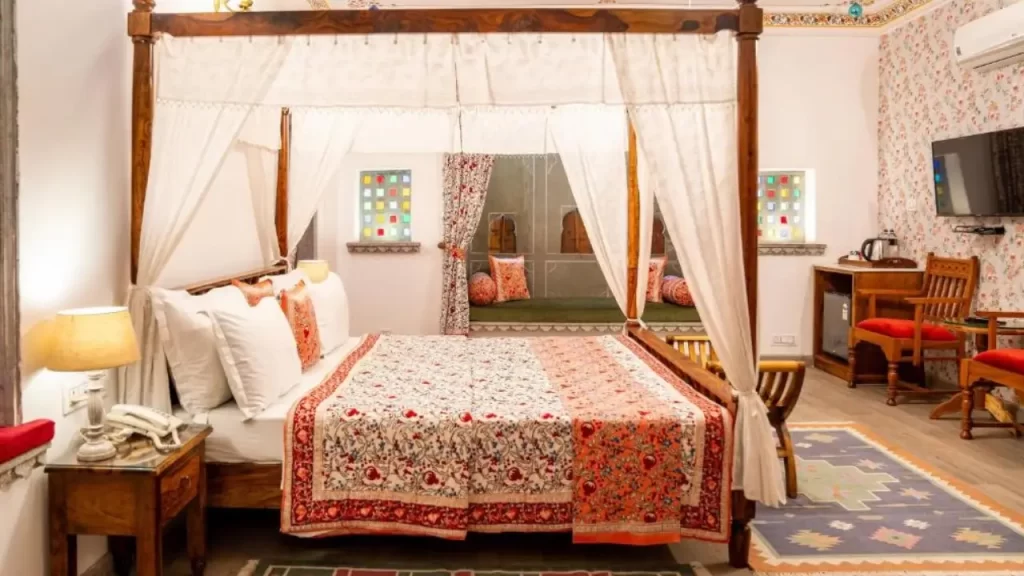 Traditional-style deluxe room at Hotel Udaigarh just minutes from City Palace Udaipur.