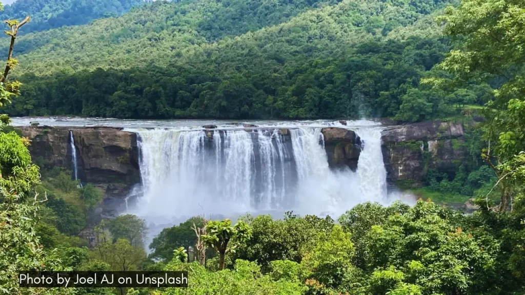 A gorgeous shot of Athirapally Falls in Thrissur Kerala one of the best places to visit in Kerala during monsoon.