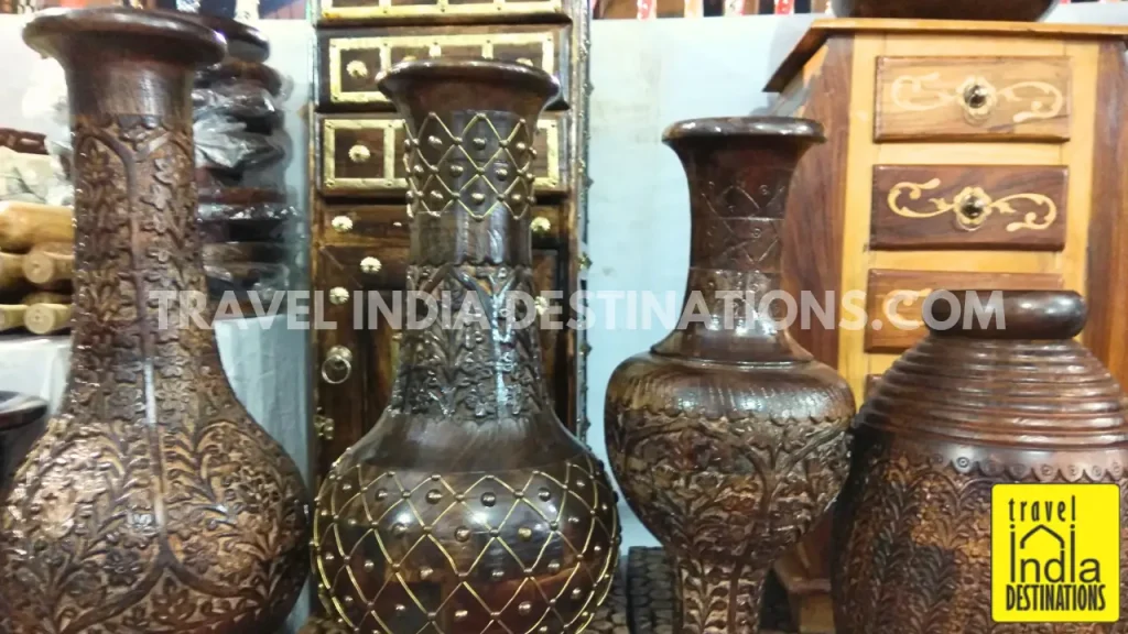 A range of wooden flower vases at a store in Jaipur